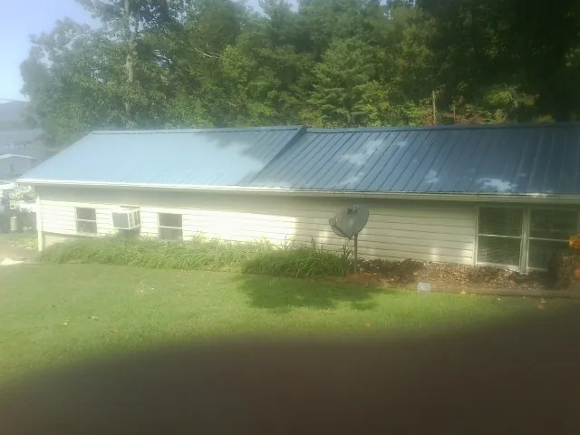 Blue metal roof running the length of a single story home in Wapakoneta